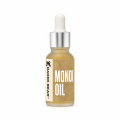Naked Bear Monoi Oil in a 0.5 fl oz frosted glass dropper bottle with a gold floral label