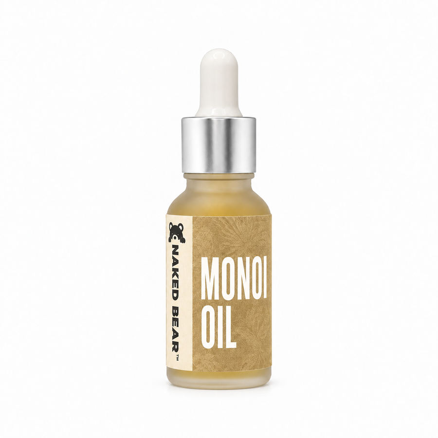 Naked Bear Monoi Oil in a 0.5 fl oz frosted glass dropper bottle with a gold floral label